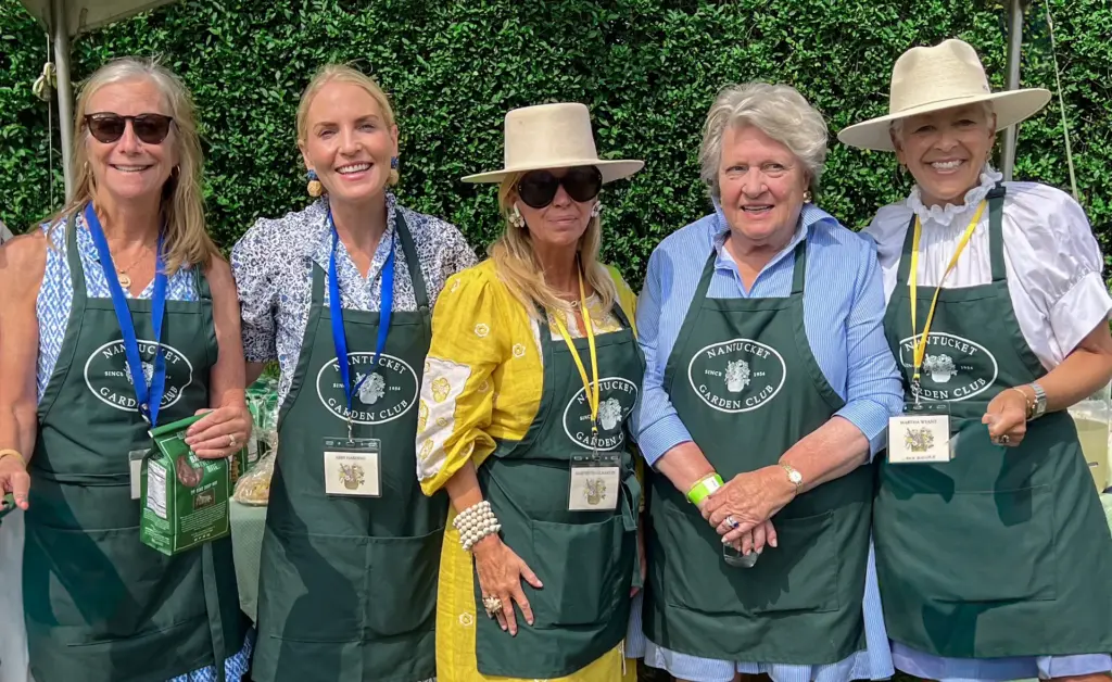 5 members of the Nantucket Garden Club posing for a photograph at a Nantucket Garden Club event.